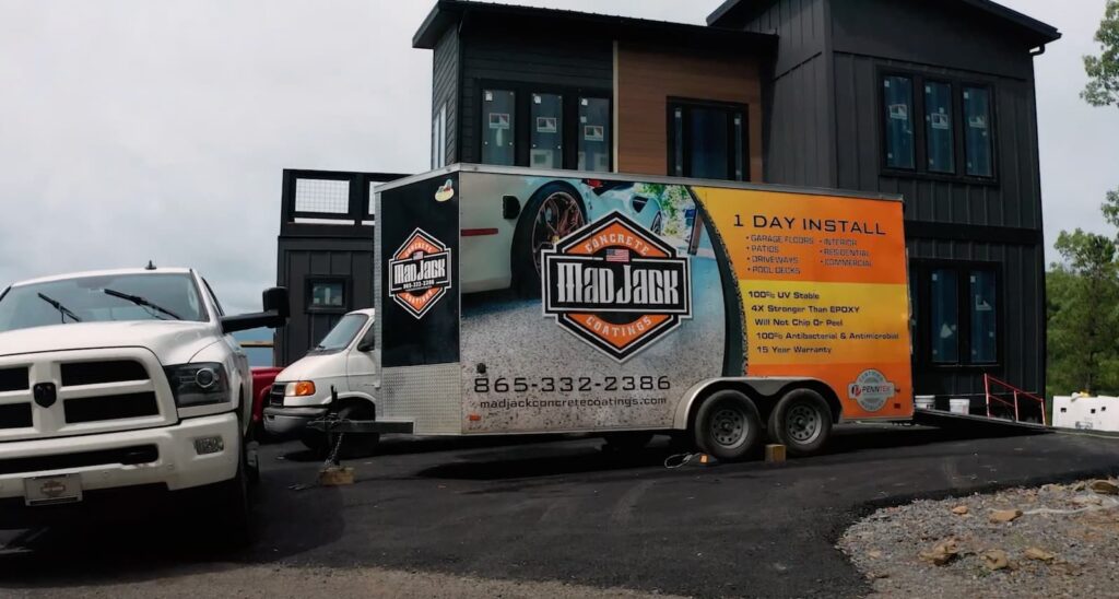 madjack trailer parked in front of concrete coating job - behind the scenes look